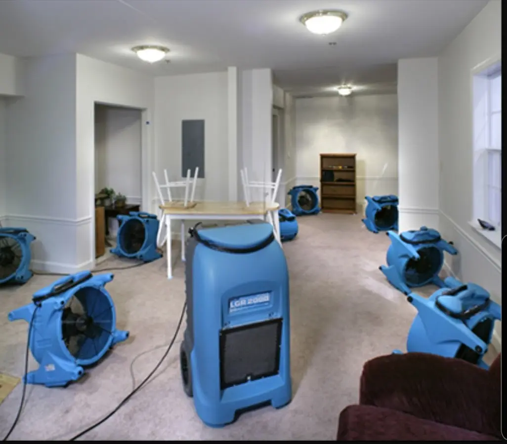 Air movers and dehumidifier setup for Water Damage Restoration in Willis